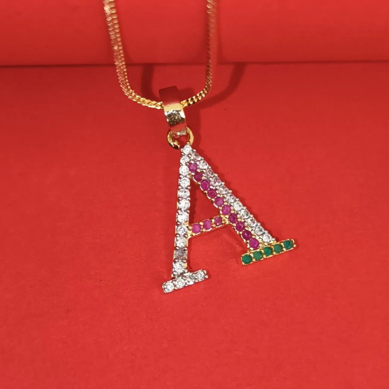 Nimoraa A Initial Gold Plated Pendant Chain with Red & Green Stones