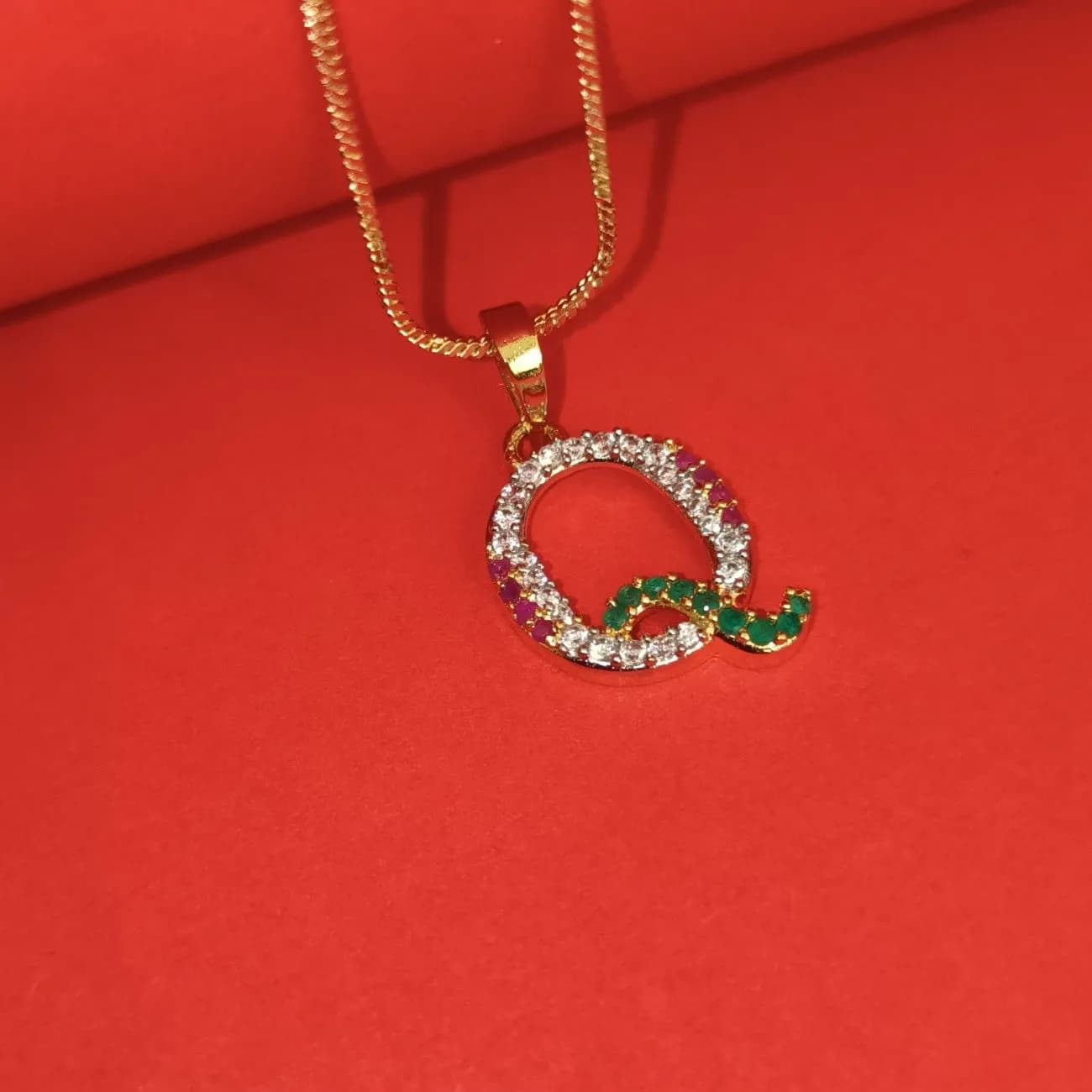 Nimoraa Q Initial Gold Plated Pendant Chain with Red & Green Stones