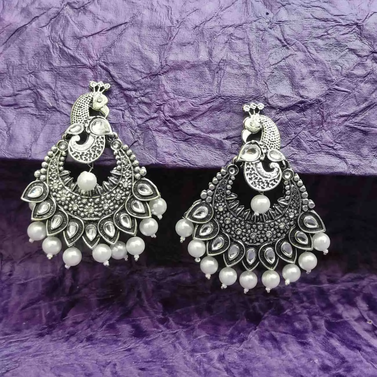 Nimoraa Zehreen Meenakari Drop Earrings with oxidised peacock motifs