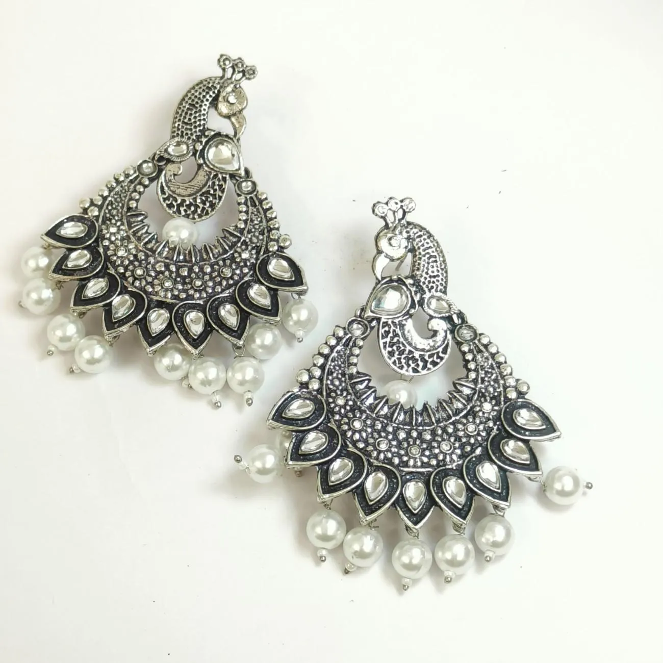 Nimoraa Zehreen Meenakari Drop Earrings with oxidised peacock motifs