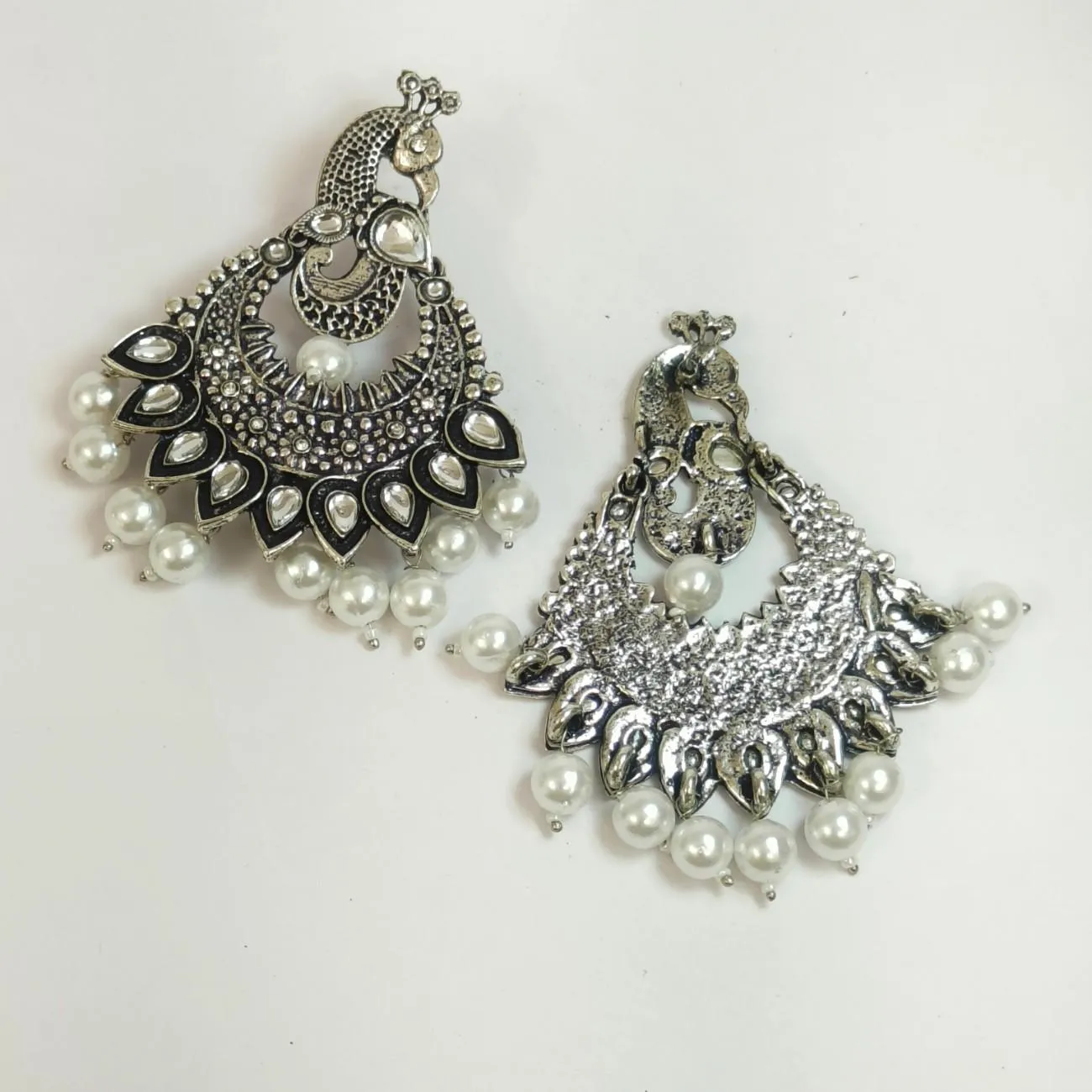 Nimoraa Zehreen Meenakari Drop Earrings with oxidised peacock motifs