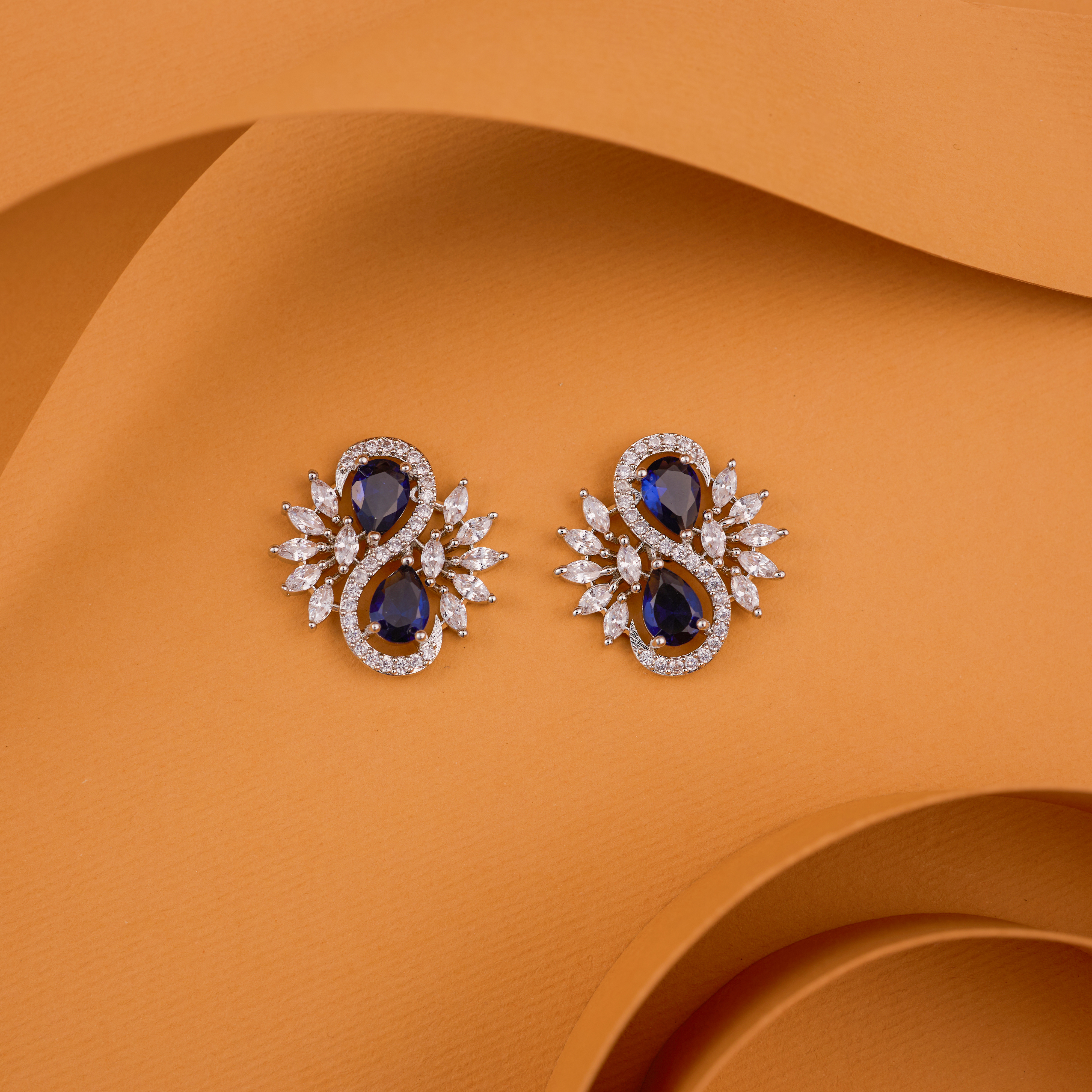 The Infinity Blue Glow Floral Studs