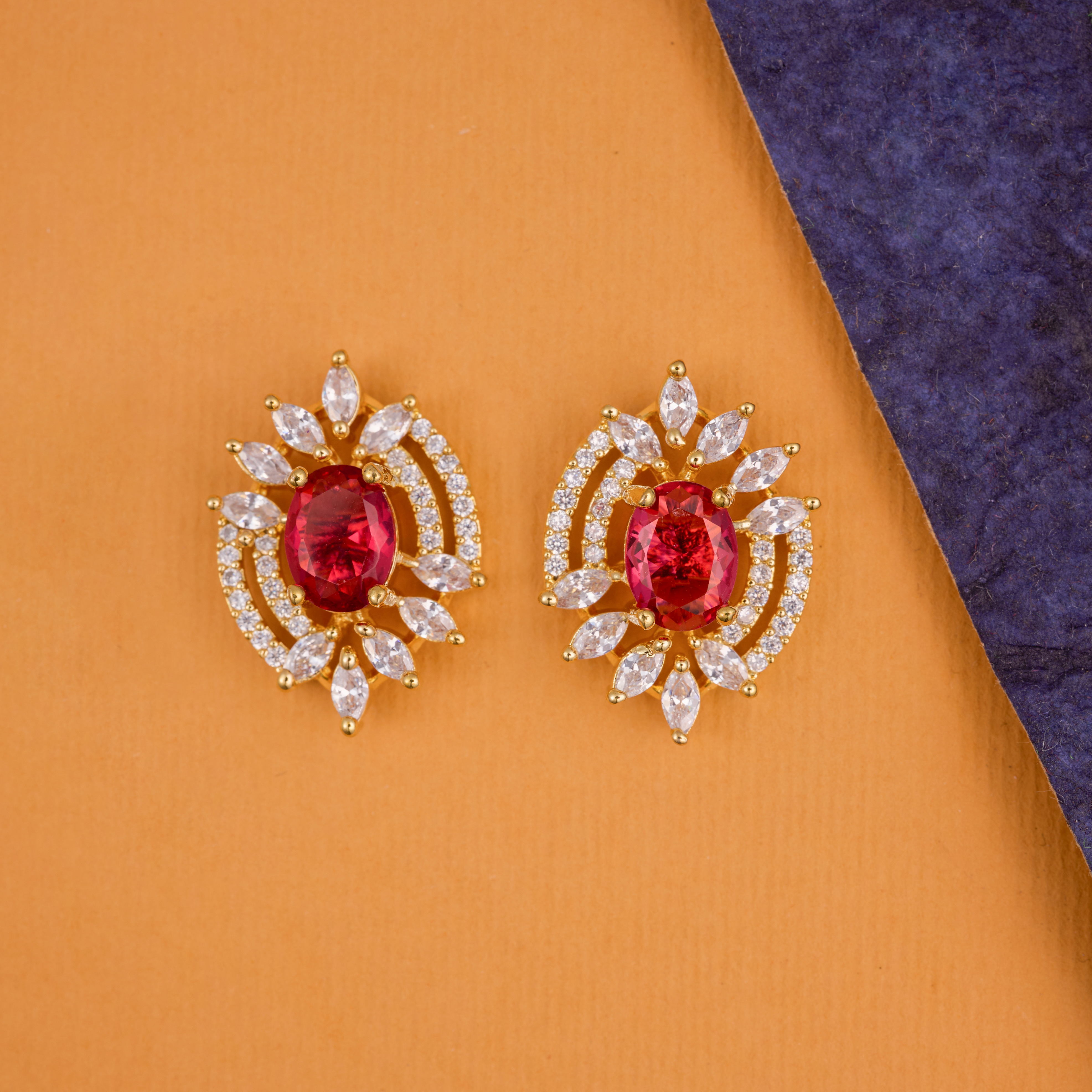 Red sparkle burst studs