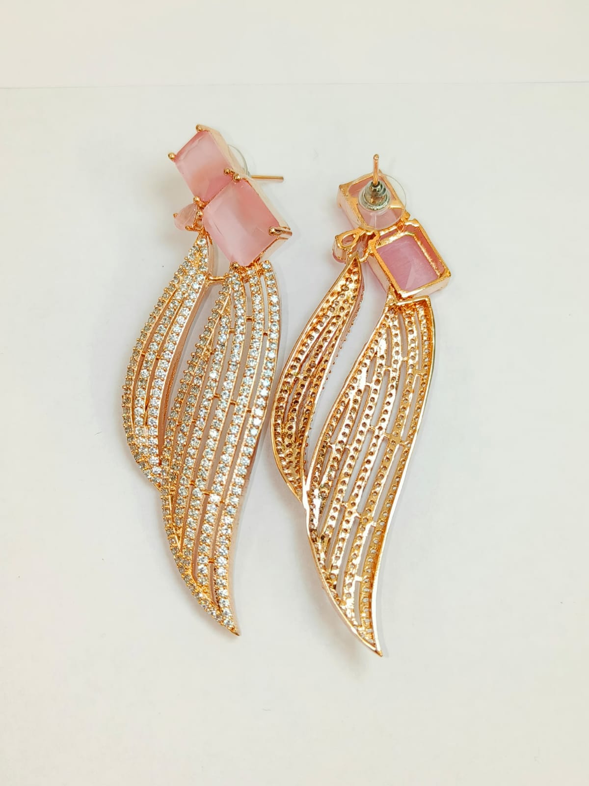 The youthful pink emerald cut dangle earrings