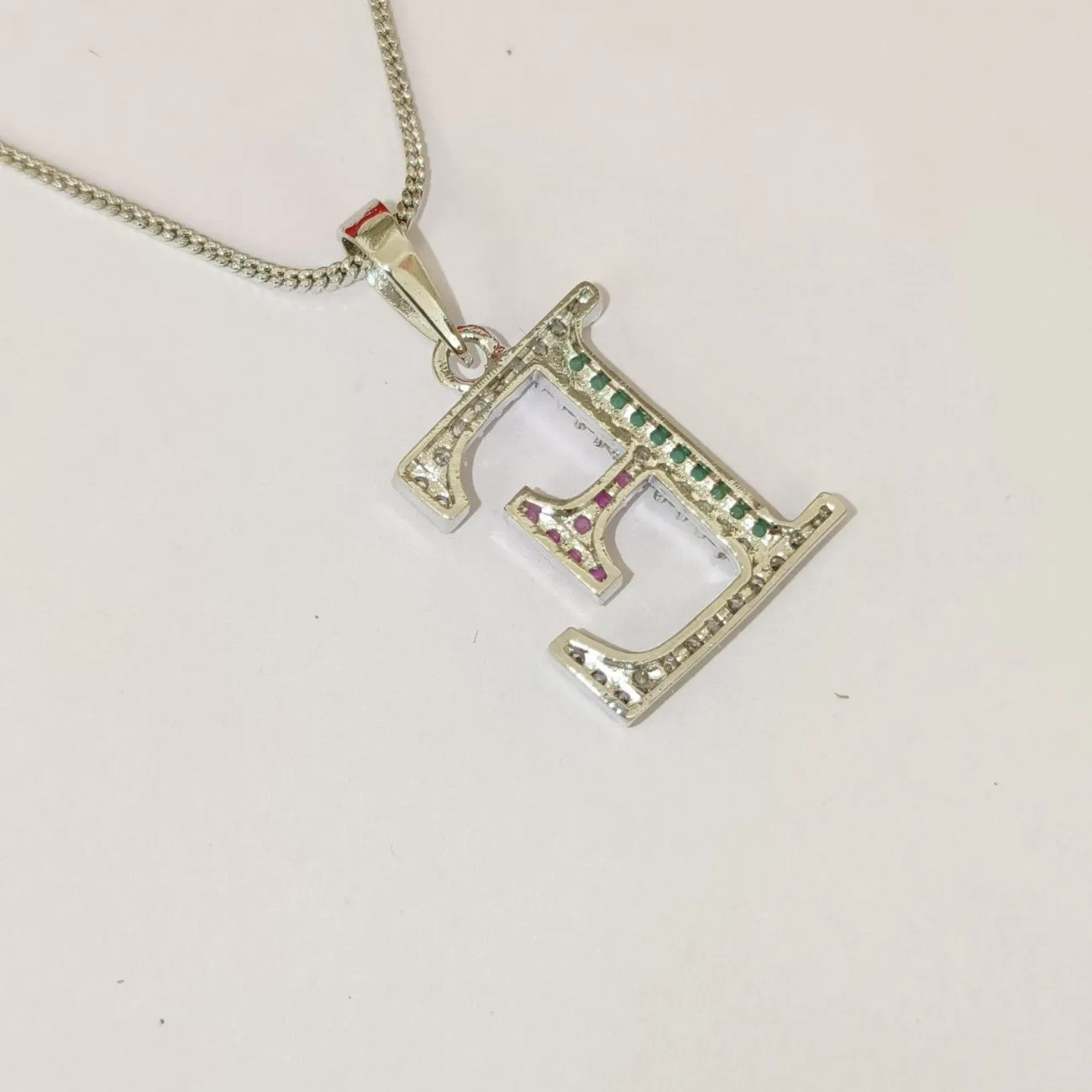 Nimoraa E Initial Silver Plated Pendant Chain with Red & Green Stones