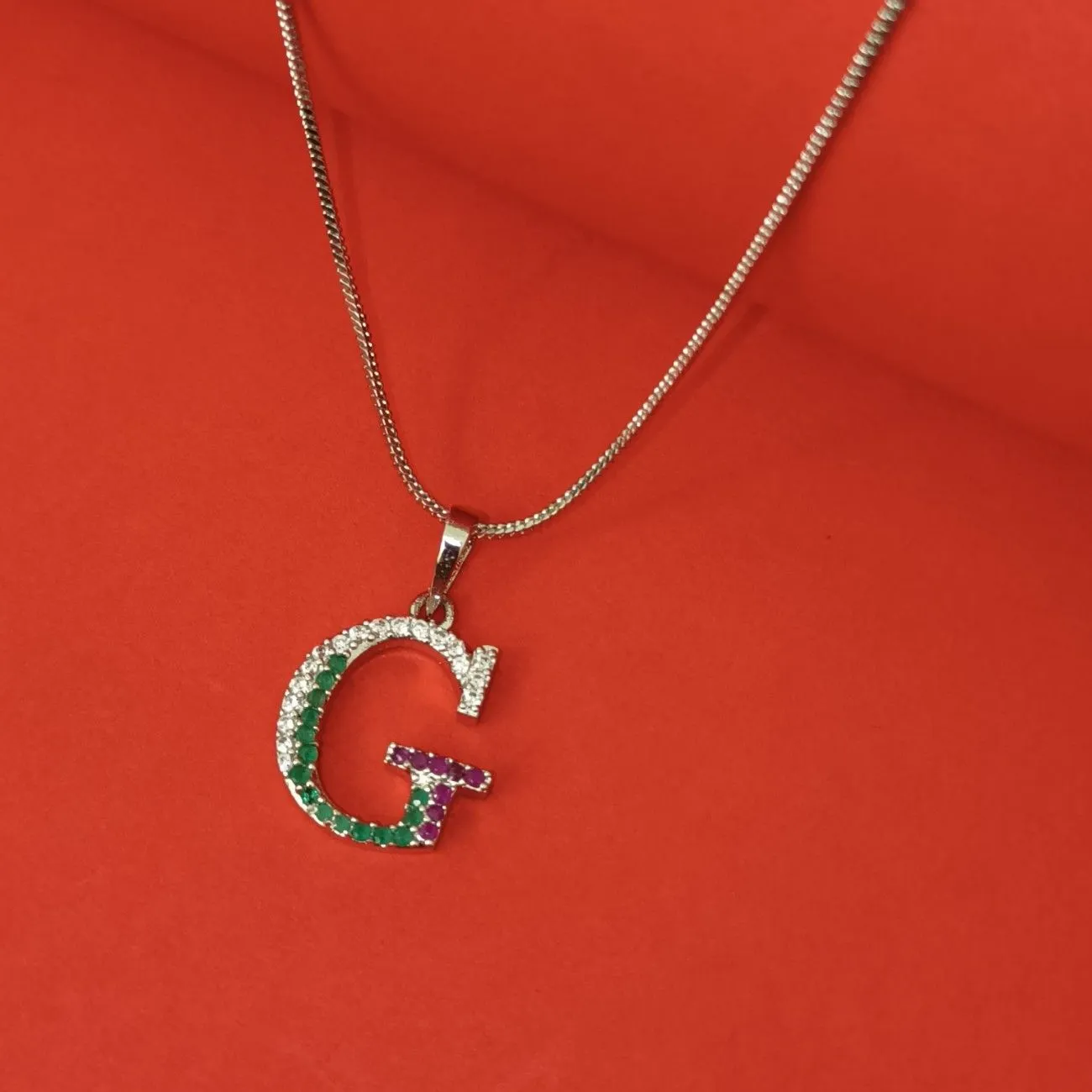 Nimoraa G Initial Silver Plated Pendant Chain with Red & Green Stones