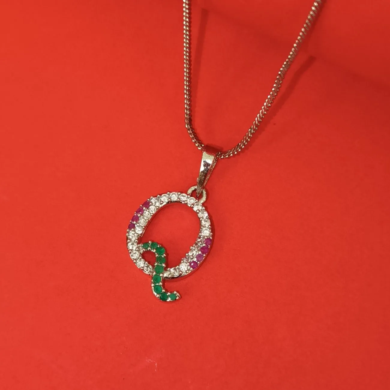 Nimoraa Q Initial Silver Plated Pendant Chain with Red & Green Stones