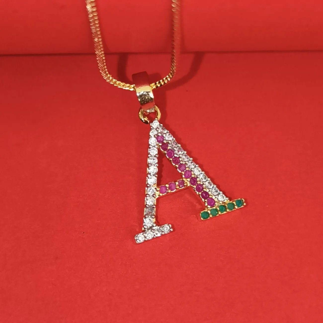 Nimoraa A Initial Gold Plated Pendant Chain with Red & Green Stones