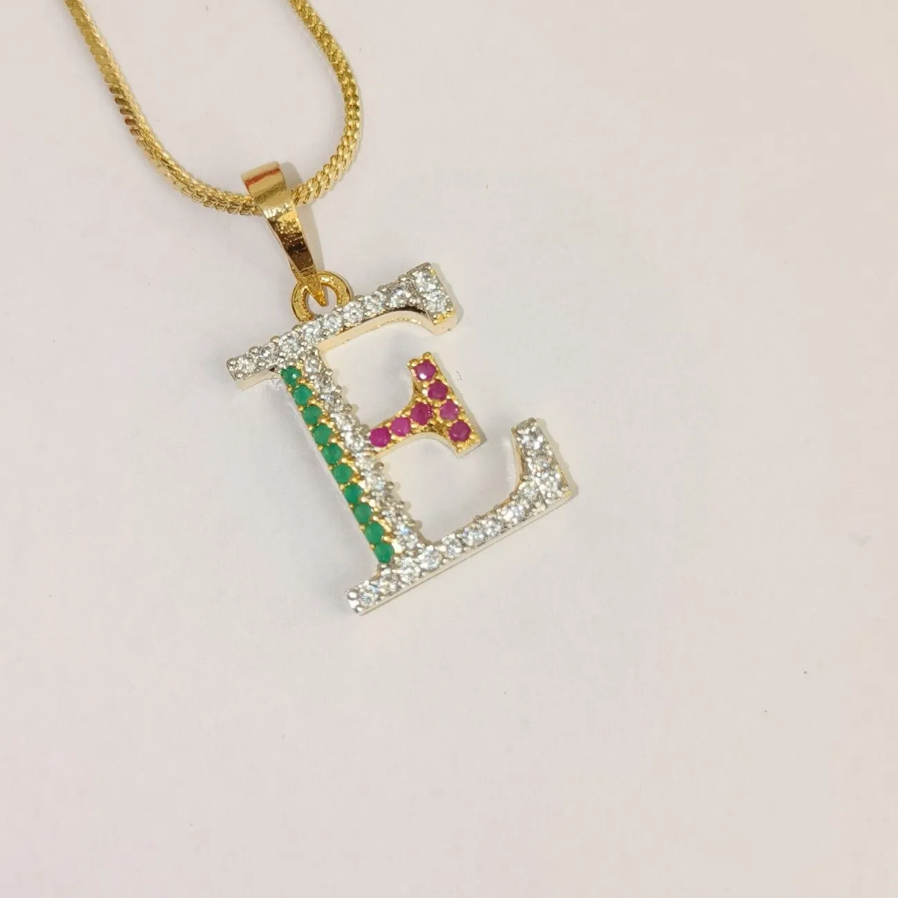 Nimoraa E Initial Gold Plated Pendant Chain with Red & Green Stones
