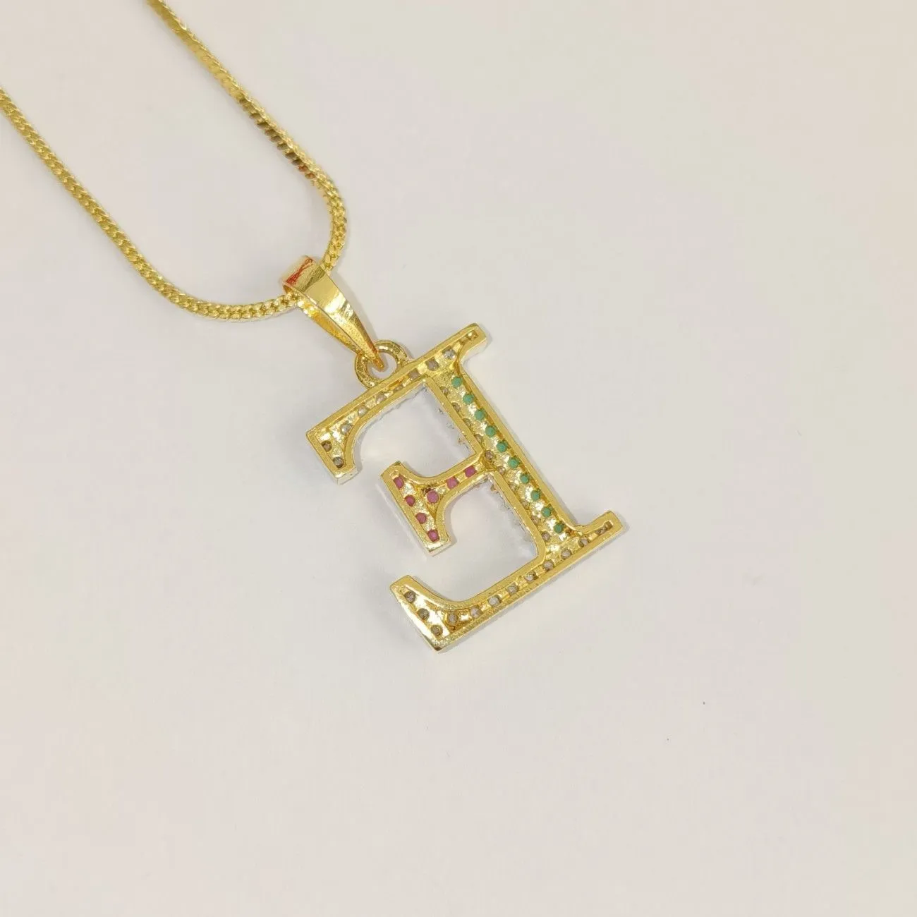 Nimoraa E Initial Gold Plated Pendant Chain with Red & Green Stones