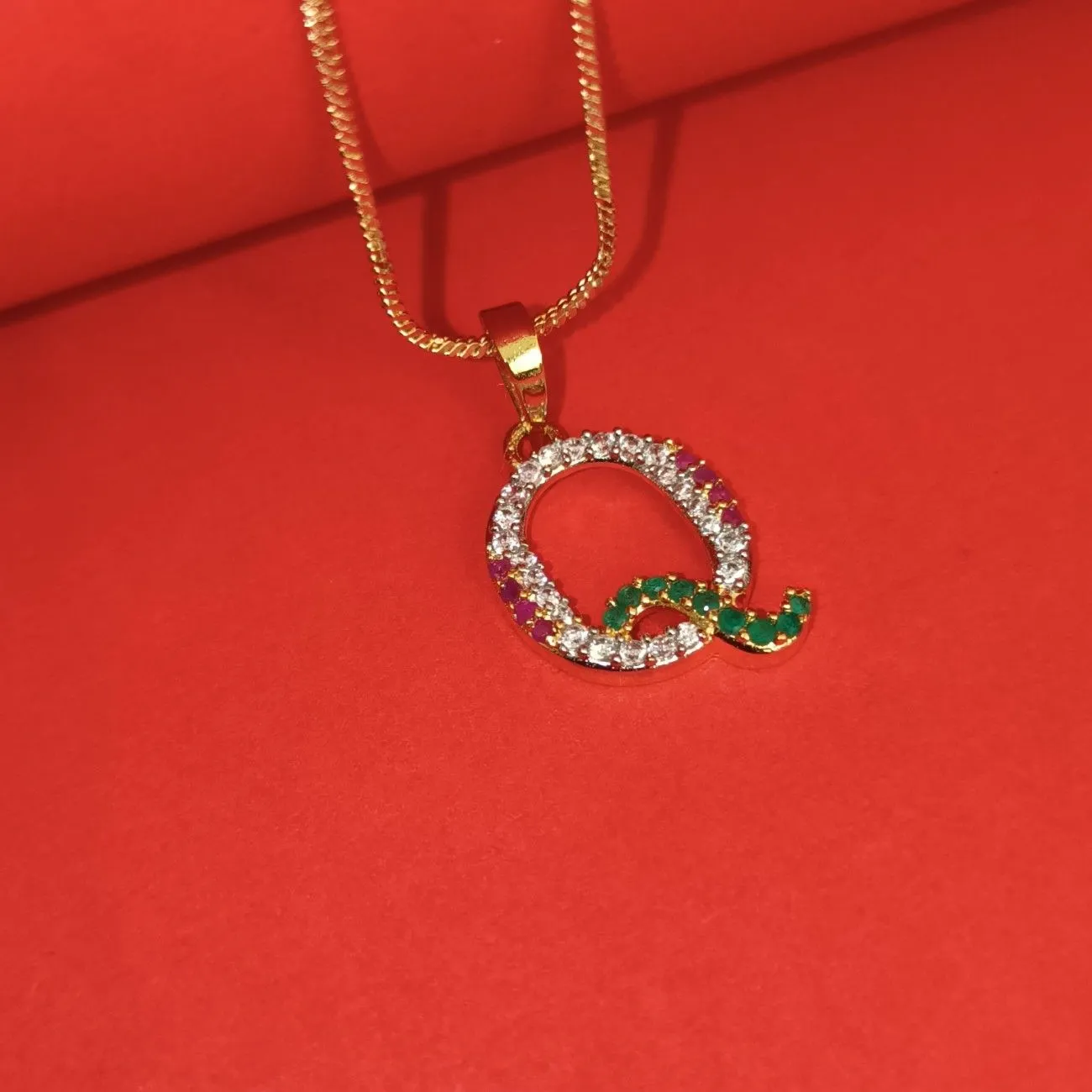 Nimoraa Q Initial Gold Plated Pendant Chain with Red & Green Stones
