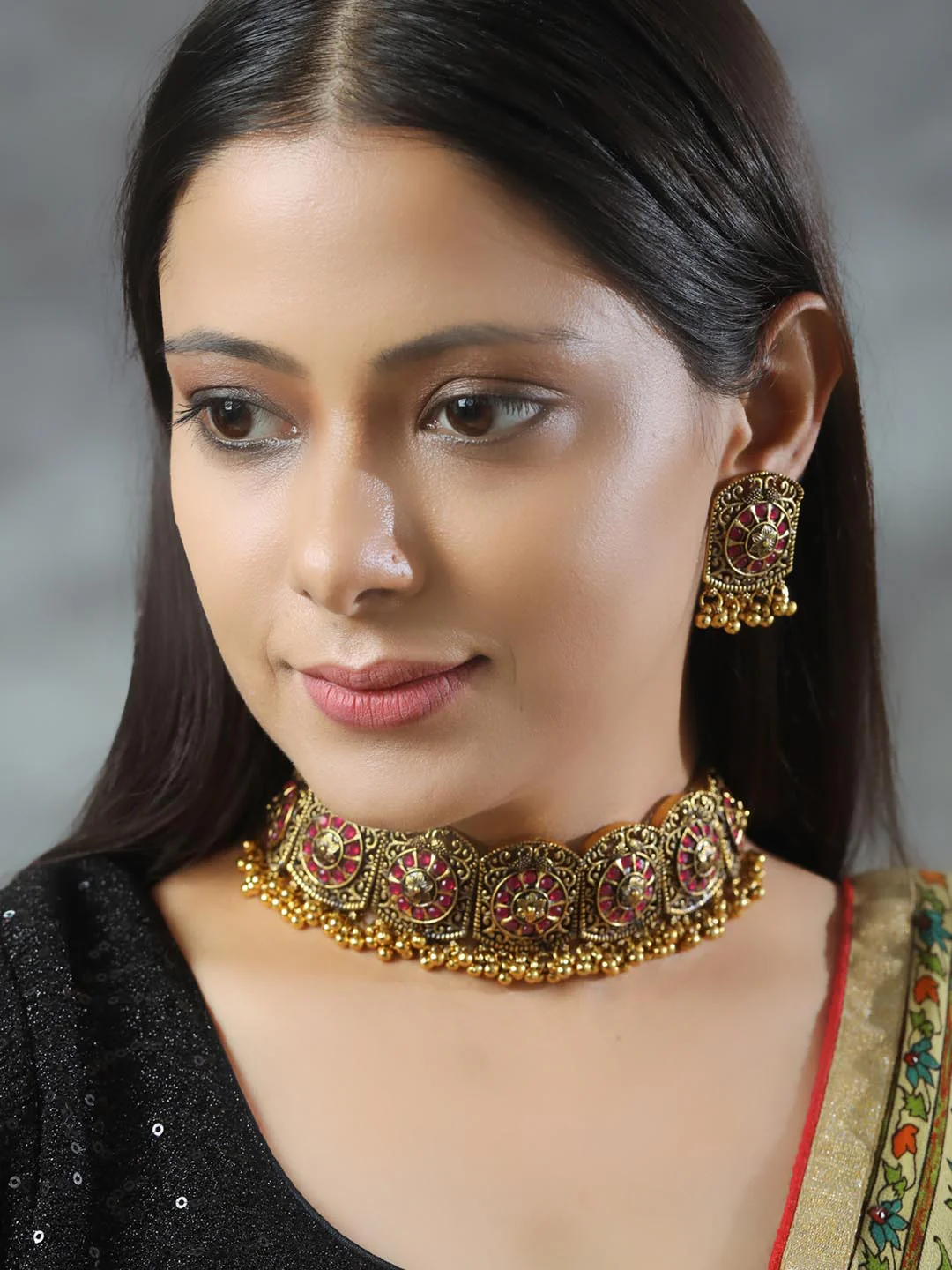 Nimoraa Antique Gold Plated Ruby Temple Choker Set with Heritage Motif Design
