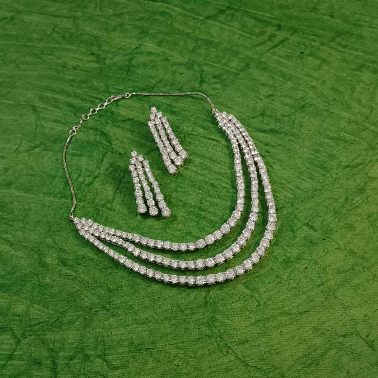 Nimoraa Triple Line Solitaire Diamond Silver Plated Necklace Set with Dazzling Triple Drop Earrings